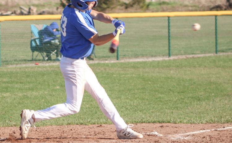 Gladwin’s Logan Walters takes a cut at a pitch during the season-opening doubleheader Friday at Pinconning.