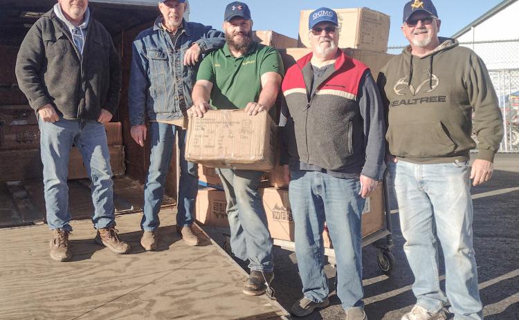 The Gladwin Christian Men’s Club Picking up 2024 boot order at Family Farm &amp; Home. Inset photo, boots delivered to Beaverton.