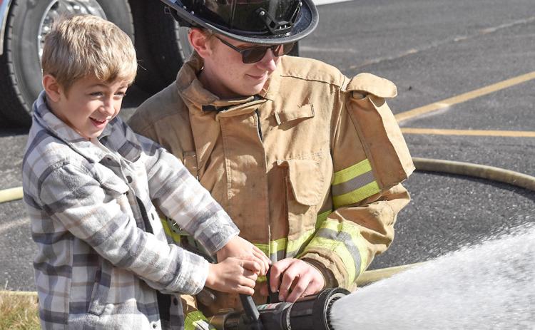 Kids at Beaverton Elementary got to spray a fire hose when Beaverton Fire Department’s Chief Phil Andrist and his partner Case Dunn visited.