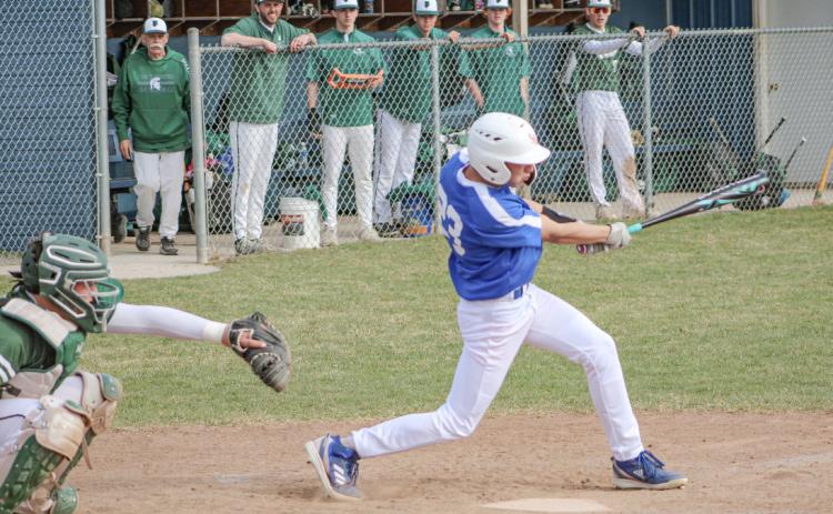 Gladwin’s Logan Walters takes a cut during the first game of Thursday’s doubleheader split with visiting Pinconning.