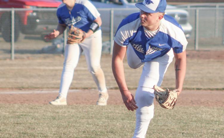 Gladwin’s Mason Meier follows through after delivering a strike during his first trip to the mound in two years Friday.
