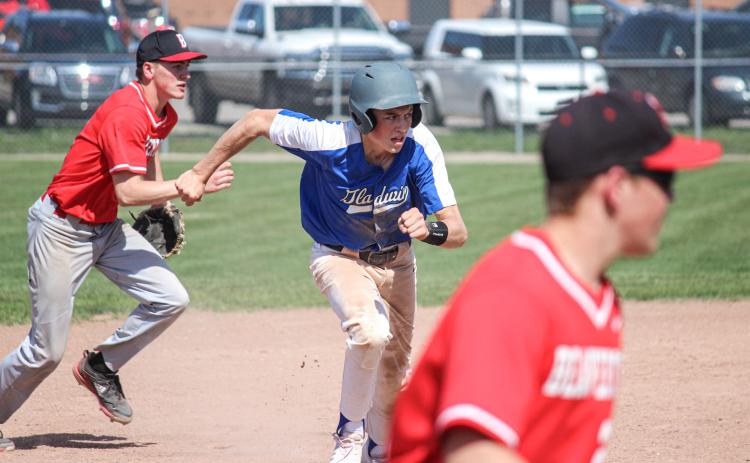 Gladwin keeps an eye on home plate as he runs to third.