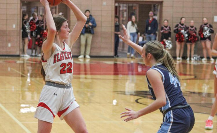 Beaverton’s Bryar Pollard holds the ball high and looks for an open teammate during Friday night’s loss to Jack Pine Conference leader Meridian. The Beavers will visit rival Gladwin Friday.