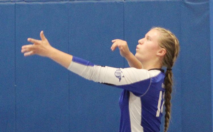 Graycin Guoan gets ready to serve one up for the Gladwin volleyball team.