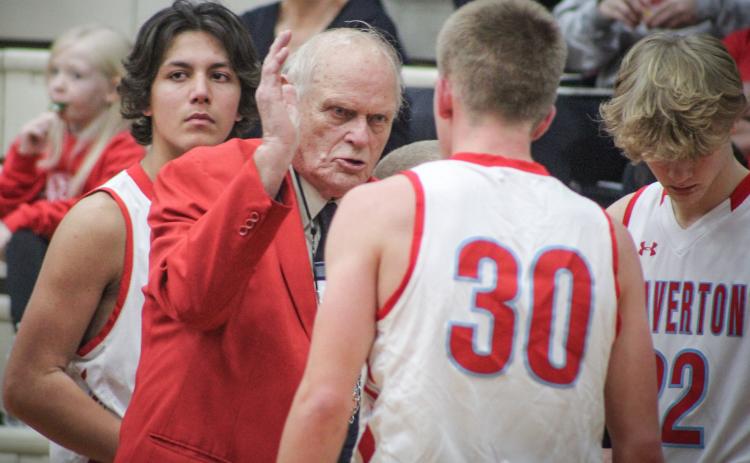 In the middle of the first game of his 50th season at the helm of the Beaverton boys’ basketball team, Beavers coach Roy Johnston makes a point to senior point guard Layk Woodruff. Beaverton beat Coleman 41-25.