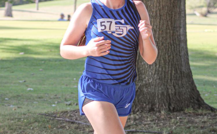 Alanis Povey competes at last week’s Jack Pine Conference jamboree. Povey was one of many Gladwin runners to post a season-best time Saturday at the Veterans Serving Veterans Invitational.