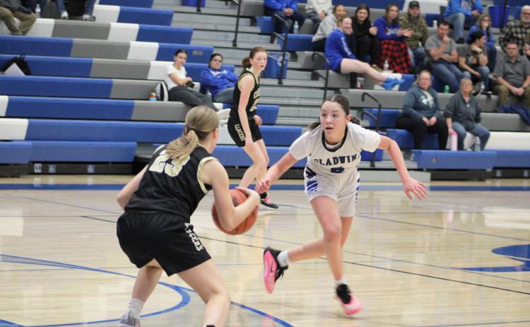 Freshman guard Liliana Gutierrez applies full-court pressure during Gladwin’s loss to visiting Bullock Creek Thursday night.