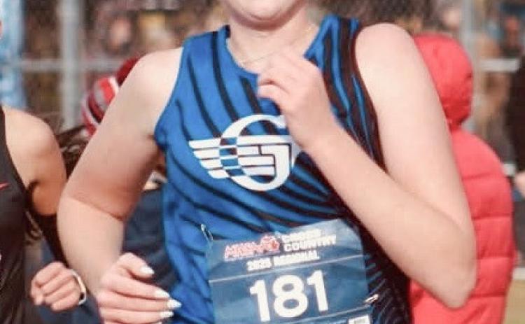 Gladwin’s Alanis Povey races to a spot at the state meet with a personal best time at the Division 2 regional Saturday at Benzie Central.