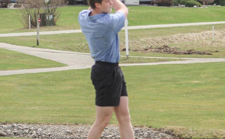 Gladwin’s Clay Newman tees off during a recent match. Newman led the Flying G’s with a 46 last Tuesday.