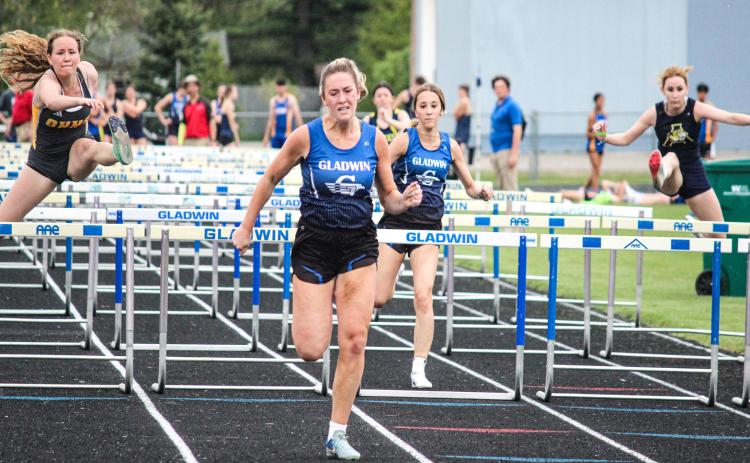 Lizzie Haines sprinting to the finish during the May 12 Legends Meet in Gladwin. Haines qualified for State Finals on Friday night in both the 100 and 300-meter hurdles.