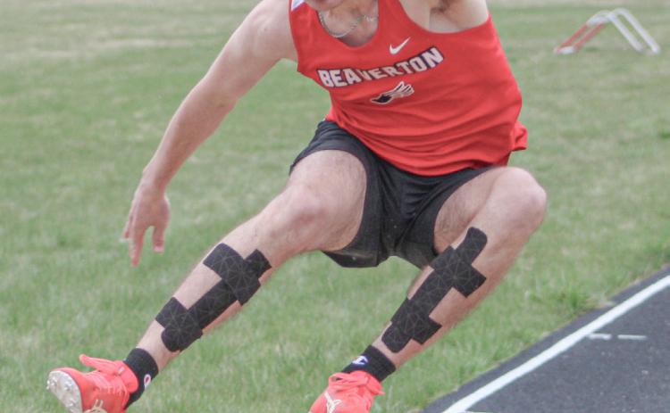 Beaverton’s Chayce Cazabon comes in for a landing in the long jump at last week’s track meet.