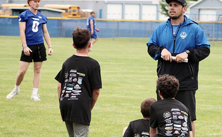 Gladwin coach Kody Emeott gives out directions last Wednesday at the Tim Foor Youth Character and FUNdamentals football camp.
