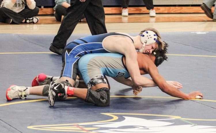 Gladwin’s Brady Demory battled his way to a 5-4 victory in the final at 120 Saturday at Shepherd to win a district title and advance to the regional.