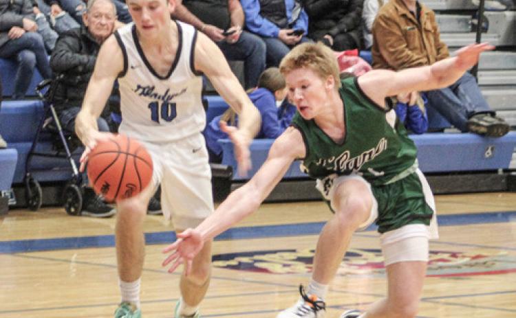 Seth Mead dribbles past a defender during Gladwin’s first meeting with Clare.