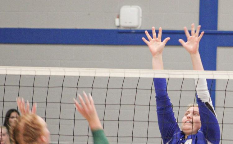 Gladwin’s Graycin Guoan goes up for the block during a recent match. The Flying G’s won twice last week and hope to close the regular season next week on a high note.