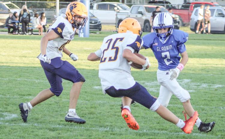 Gladwin’s Bryson Thurlow closes in on a Standish ball-carrier during the junior varsity’s loss last Thursday to the visiting Panthers.
