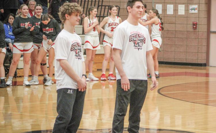Beaverton All-State and All-Jack Pine Conference honorees Eric Larson (left) and Eli Roe were saluted prior to the girls’ basketball game last Wednesday.