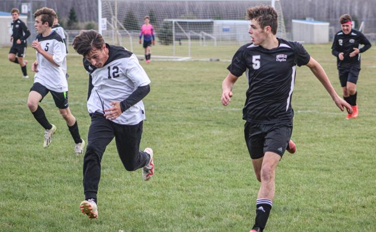 Logan LaBrosse, #5, attempts to get the ball through Bridgeport’s defense.