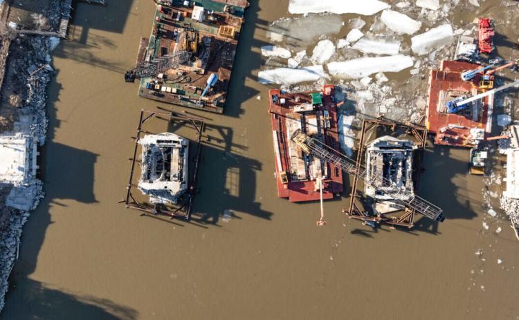 An overhead view of construction on the Lafayette Bridge Project placing steel ring for metal sheet around piers.