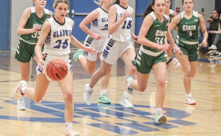 Gladwin’s Breanna Campbell leads the way across the time line on the fast break during Friday night’s 44-36 loss to visiting Clare.