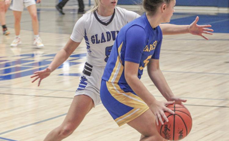 Gladwin’s Breanna Campbell applies the defensive pressure during Thursday night’s victory over Harrison, the first of the season for the Flying G’s.