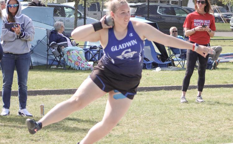 Gladwin’s Makenzie Price puts the shot a school record distance of 42’10.25” to win the gold medal at Cadillac’s Division 2 regional Friday.