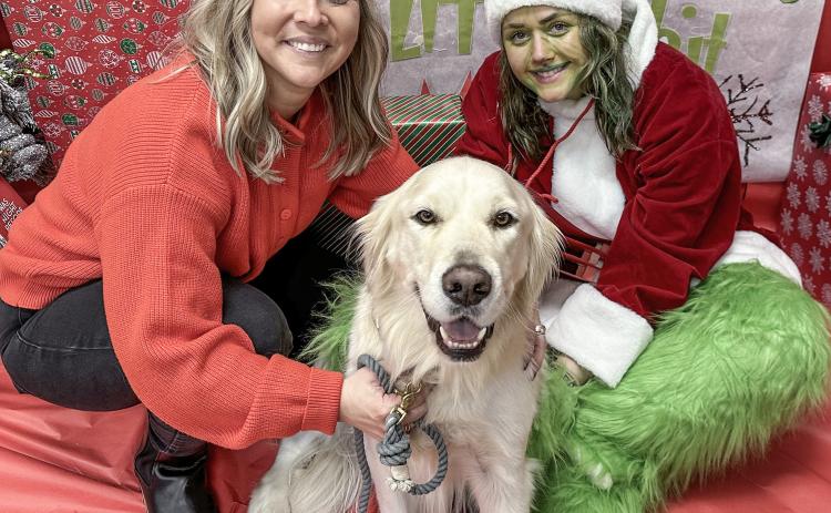 Clare-Gladwin RESD Occupational Therapist Hilary Vasher (at left), Therapy Dog Mac and Special Education teacher Katherine Schallhorn (at right).
