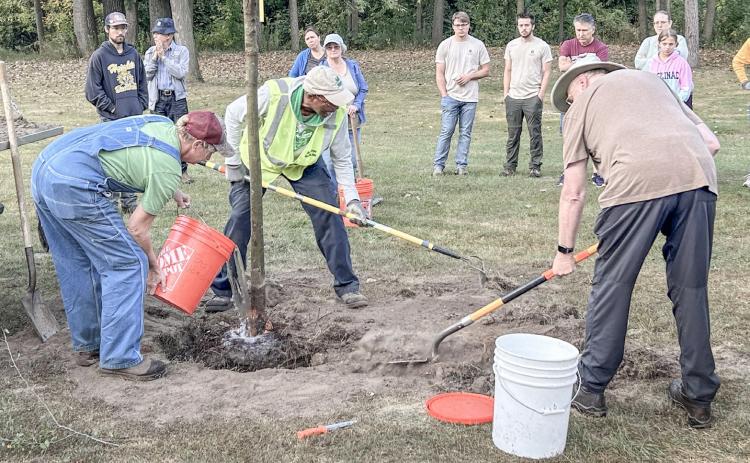 VOLUNTEERS HELP TO PLANT RELEAF AWARDED TREES AROUND GLADWIN