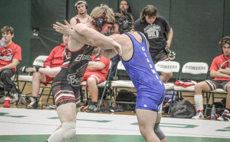 Beaverton’s Ian Krezenski and Gladwin’s Gaven Evans-Ferguson square off at 165 during last Wednesday’s dual meet at Clare. Evans-Ferguson earned a 10-5 decision to help the Flying G’s to a 58-16 victory.