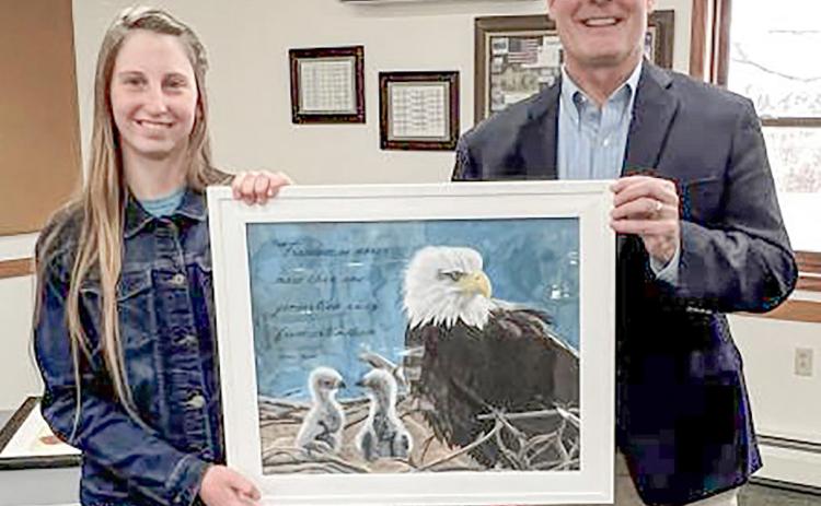 Congressman John Moolenaar and Nevada Draper, the winner of the 2025 Congressional Art Competition for Michigan’s Second District, and her painting, “One Generation Away.”