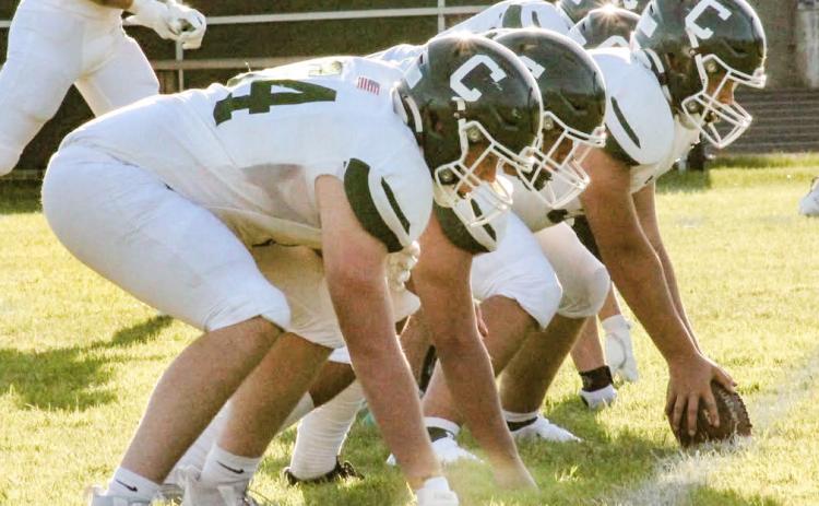 The Clare offensive line is ready for the snap Thursday night during the Pioneers victory at Grayling.