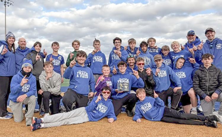The Gladwin Junior High boys’ track team celebrates a successful trip to the Ithaca Relays last Thursday.
