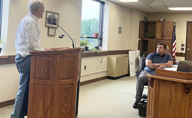 Wade Trim Planner, Arthur Mullin, discusses the draft of the Master Plan with County Commissioner Alan Donaldson at Tuesday’s board meeting.