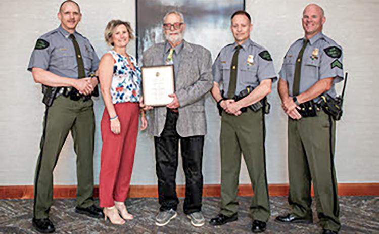 Dale Hendershot of Gladwin was honored as the Michigan Department of Natural Resources 2024 Hunter Education Instructor of the Year. Hendershot has been a volunteer hunter safety education instructor for more than 34 years. Pictured, left to right are Chief Jason Haines, DNR Law Enforcement Division; Erica Moore, DNR department specialist; Hendershot; Lt. Tom Wanless and Cpl. Ken Lowell, both with the DNR Law Enforcement Division.