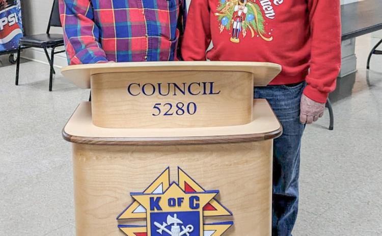 Pictured is Al von Matt (right) and Monsignor Koper (left), both are Knights of Columbus members. The podium in the picture was crafted by Al Von Mott and he donated it to Knights of Columbus, Gladwin Council 5280.