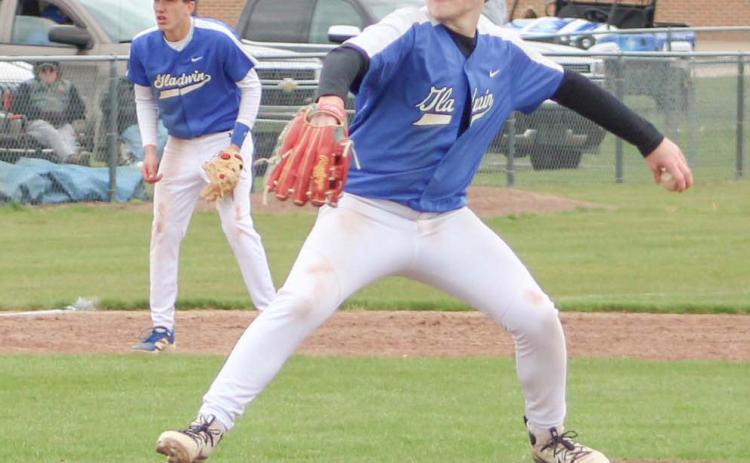 Gladwin pitcher Karter Phillips delivers a strike during Friday’s doubleheader split with visiting Remus Chippewa Hills.