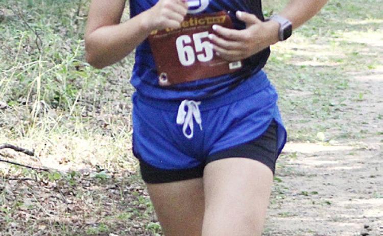 Gladwin’s Olivia Evans posted a career-best time at an invitational at Shepherd last week.