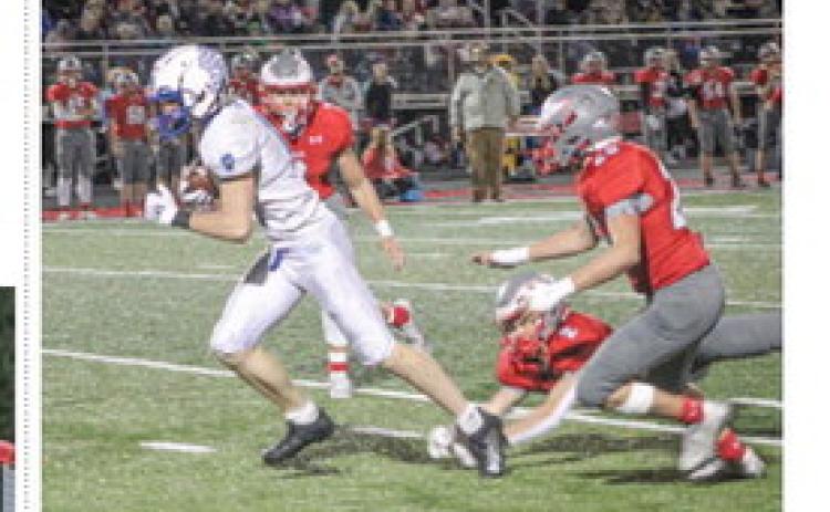 Gladwin’s Ike Wheeler breaks a tackle and heads into the clear after catching a pass during Friday night’s loss at Frankenmuth.