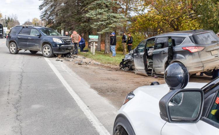 Responders assess damage after a head-on collision on M-18.