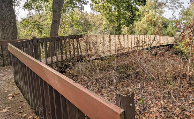 City employees pitch in to fix bridge
