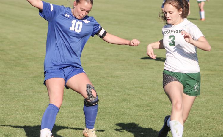Madisyn Lockwood puts the moves on the Pinconning defense during last week’s 4-4 tie with the Spartans.