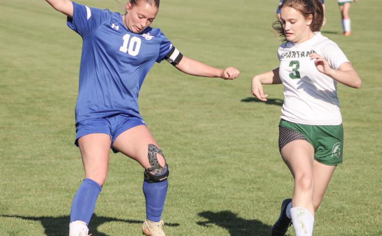 Madisyn Lockwood puts the moves on the Pinconning defense during last week’s 4-4 tie with the Spartans.