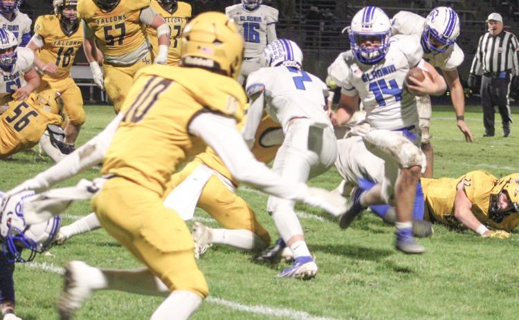 Preston Willert races out of the backfield during Gladwin’s 28-19 victory at Ogemaw Heights Friday night in the second round of the Division 5 playoffs.