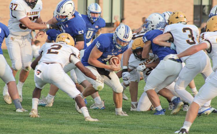 Ogemaw Heights’ Elijah Smith gets into position to tackle Gladwin quarterback Colton Pfenninger during Friday night’s victory for the Falcons. COURTNEY VERELLEN