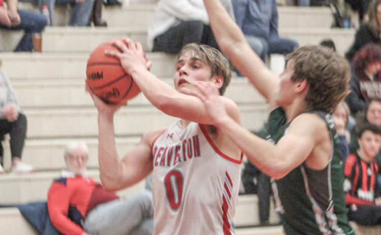 Beaverton’s Caiden Loar takes the contact on a drive to the basket during last week’s district semifinal loss to Pinconning.