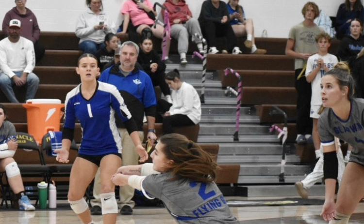 Gladwin’s Peyton Hillier keeps the ball off the floor during a recent match. The Flying G’s beat Standish and Farwell last week for third place in the Jack Pine Conference.