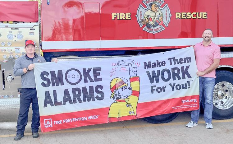 Pictured are Phil Andrist and Brent Mishler promoting Fire Prevention Week.