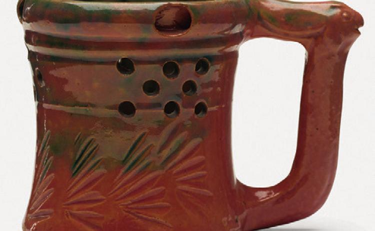 George E. Ohr’s pottery can be recognized by its thin clay, vividly colored glaze and an overall sense of eccentricity.