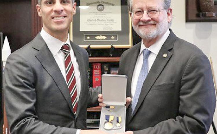 Pictured left to right are Thomas Mancinelli and Gary Peters.