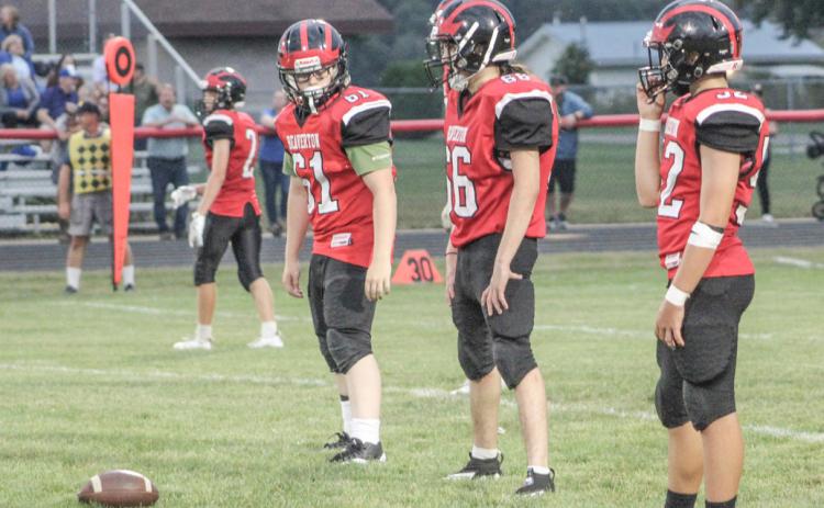 Beaverton’s (left to right) Sawyer Gordert, Angel Cerda and Logan Klimkiewicz prepare for the snap during a recent junior varsity game.